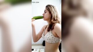 Iranian girl has fun with a cucumber