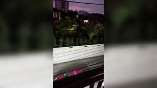 Asian girl naked on balcony and throws garbage naked