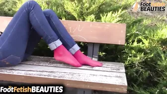 Former playmate Diana takes off her shoes and socks in a public park, then relaxes on a bench showin