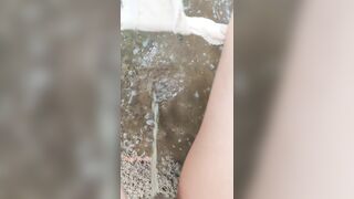 Massive Pee to the wet sand and make a puddle [Close up]