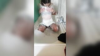 Wet clothes fan request in bathtub with bubbles and soap