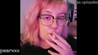 cute quiet girl smokes a hemp cigarette