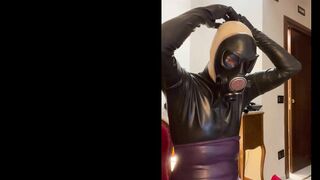 Latexitaly wears his fetish gasmask over a blue latex hood