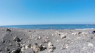 swimming at a nudist beach in Santorini Greece