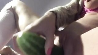 Woman fucks herself with a cucumber