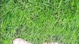 Sexy young feet playing in the grass