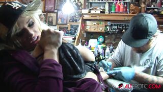 Shyla Stylez gets tattooed while playing with her tits