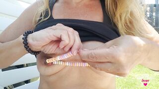 nippleringlover inserting chain with candies through large gauge nipple piercings with nipple tunnel