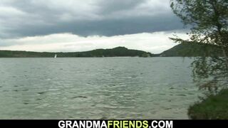 Hot grandma is used by two dudes outdoors