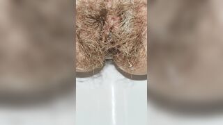 Hairy pussy pissing in the office toilet after quick sex with creampie