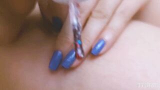 Teen with beautiful nails and legs is painting her nails while masturbate