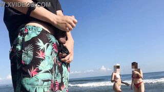 Exhibitionist voyeur flashes dick on public beach in front of two horny girls